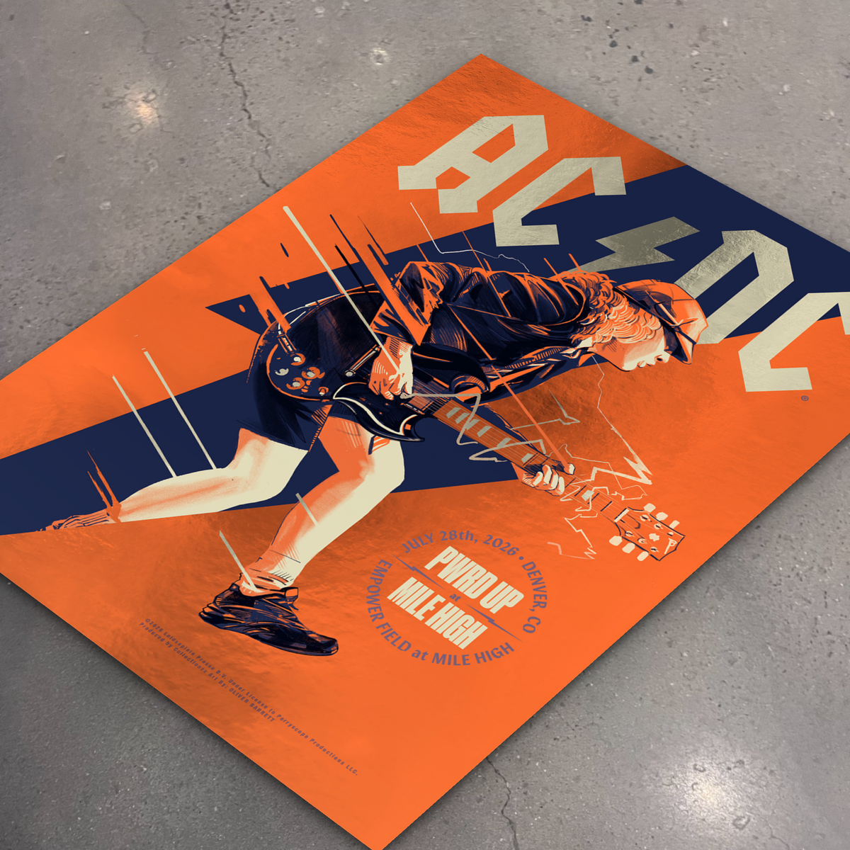 AC/DC · Denver (Foil) — flat lay on shop floor